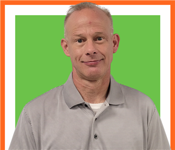 William, SERVPRO employee cutout against a green background