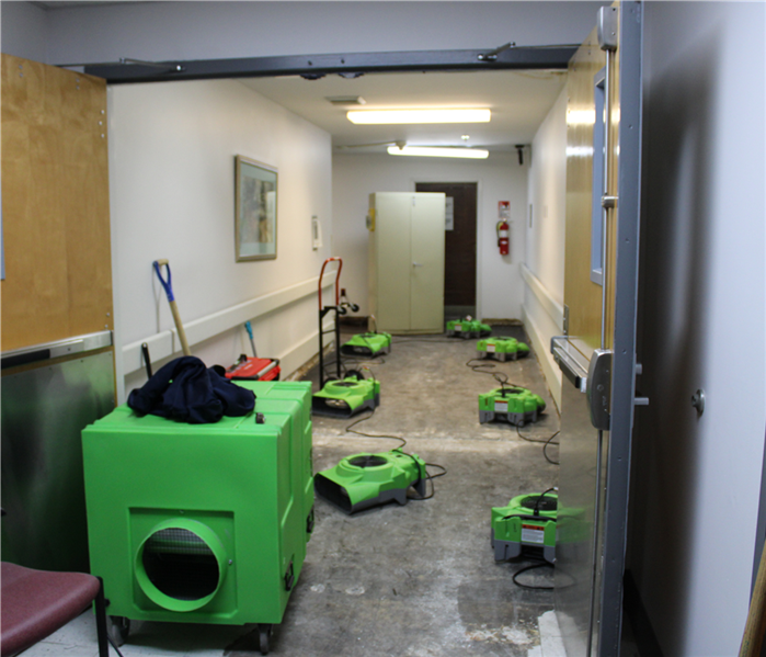 air mover equipment drying out water damage after a leak in a Fort Worth building